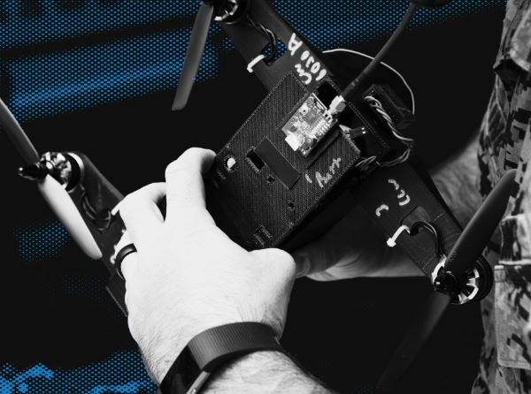 Hands holding a drone