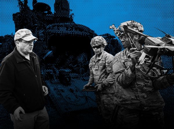 Civilian taling with a pair of Soldiers